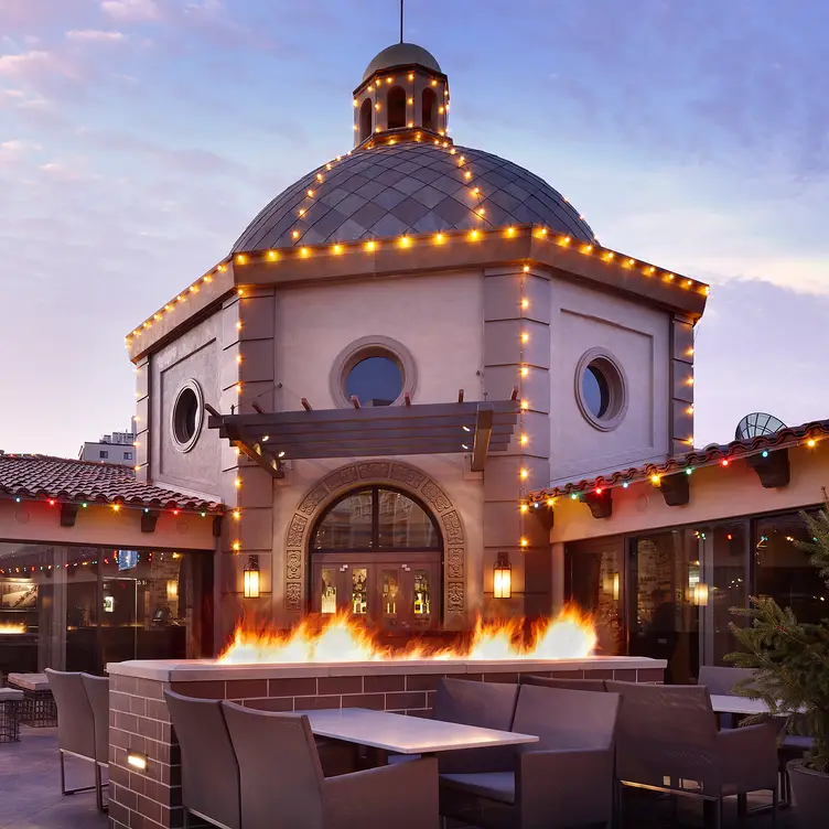 american restaurants in kansas city: Gram & Dun outdoor patio exterior at dusk in Kansas city