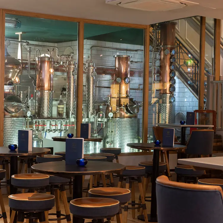 Seating with distillery view - The City of London Distillery and Bar, London, 