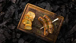 Una foto del restaurante Carbón Parrilla de Barrio - Sonata