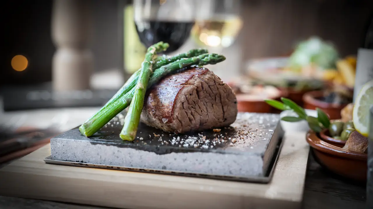 Quality steaks on hot lava stone.  - STONEAGED at The White Swan, Henley-in-Arden, Warwickshire