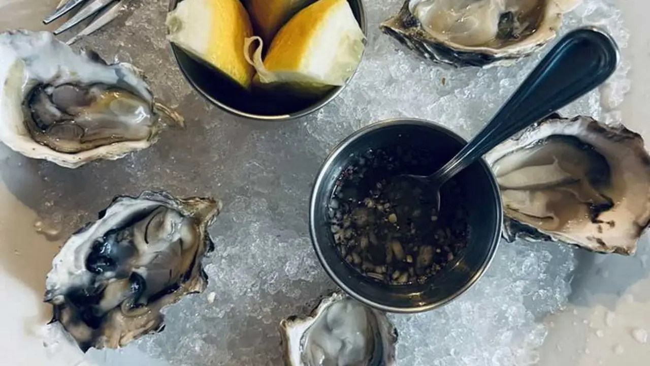 Half Dozen Oysters on a bed of ice with lemon - Trinity, San Francisco, CA
