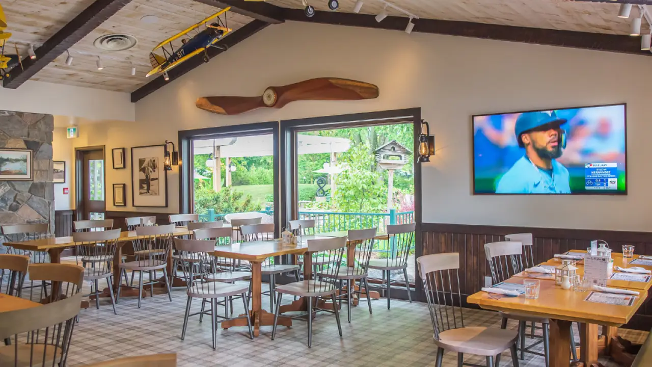 Casual family-friendly pub atmosphere with patio. - Wild Blue Yonder & Patio - Elmhirst Resort, Keene, ON