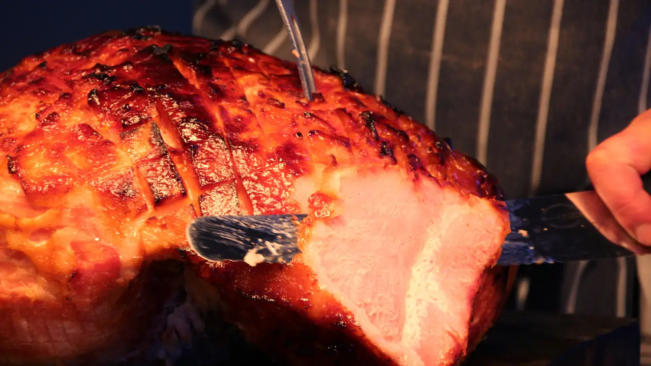Chef cutting into marmalade glazed gammon - Atrium Bistro at Whittlebury Park, Towcester, Northamptonshire