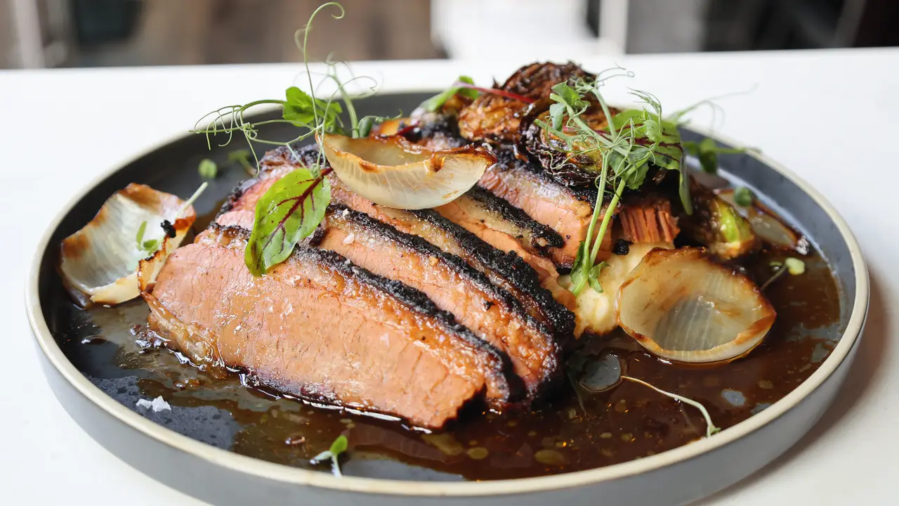 Slow-smoked brisket with a smokey molasses jus - Cowboy Sally's, Liberty Township, OH