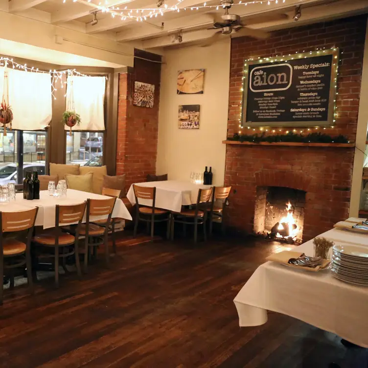 Dinning room: A cozy fireplace. - Cafe Aion, Boulder, CO