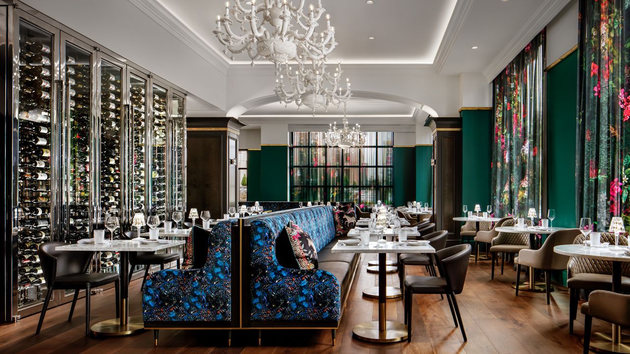 Mico Restaurant dining room at Grand Bohemian Charlotte with patterned seating and ornate chandeliers