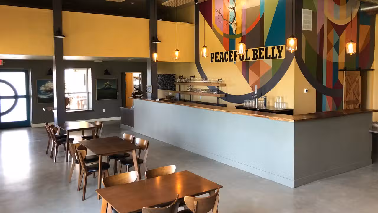 Our indoor seating area with bar top and tables. - Peaceful Belly Farm, Caldwell, ID