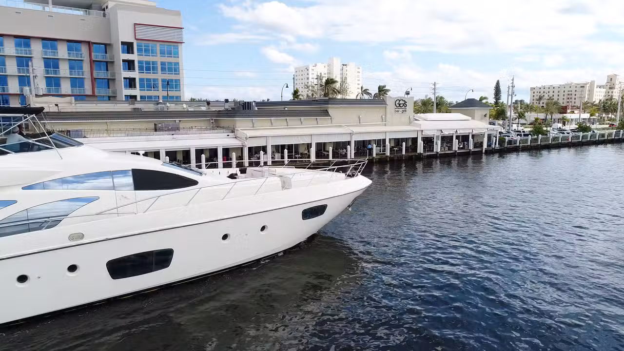 Beautiful yacht cruising by GG's Waterfront - GG's Waterfront Bar & Grill, Hollywood, FL