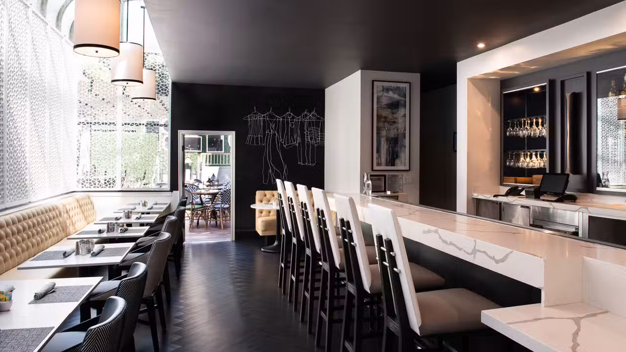 Our lively dining area includes a full service bar - The Fitting Room, West Hollywood, CA