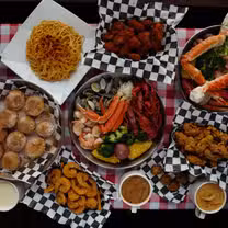 A photo of Crab King Cajun Boil & Sushi restaurant