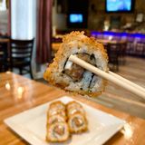Cover image for Sakitumi Grill and Sushi Bar