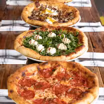 A photo of Pie Tap Pizza + Rotisserie + Bar - Magnolia restaurant