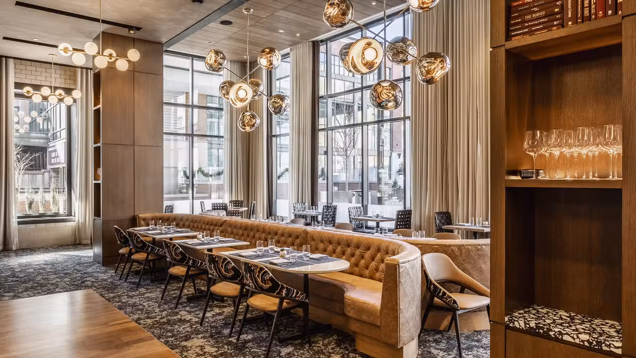 Tables with booths and chairs at Commission Row - Commission Row, Indianapolis, IN