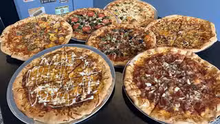 A photo of Mother Clucker's Pizza restaurant