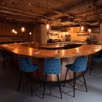 A photo of B E H I N D restaurant