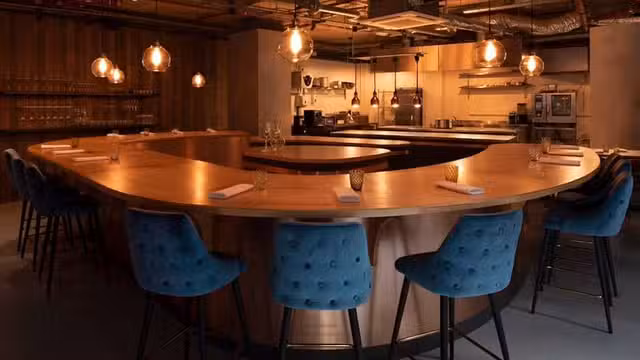 A photo of B E H I N D restaurant