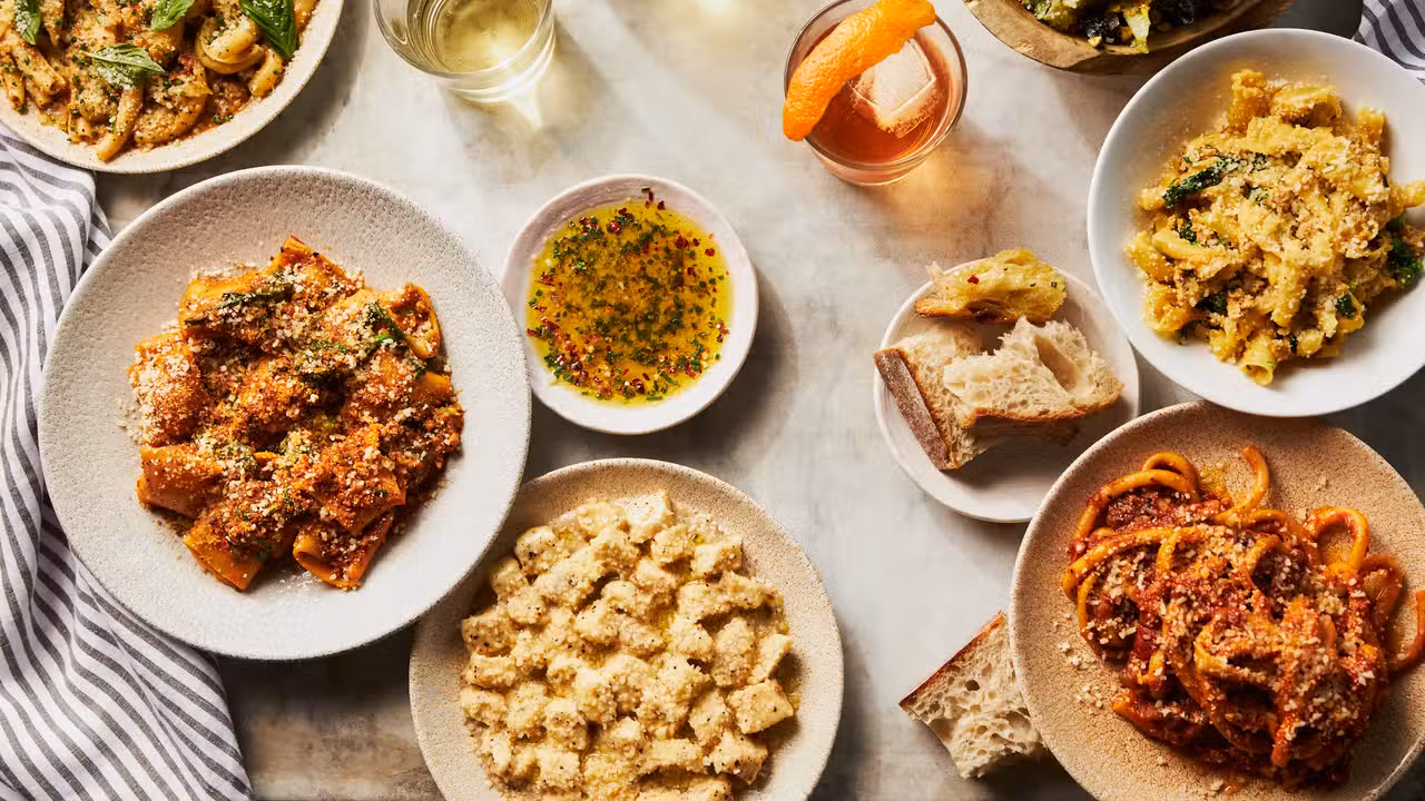 A spread of home made pasta, cocktails, and wine - MIDA - Fenway, Boston, MA