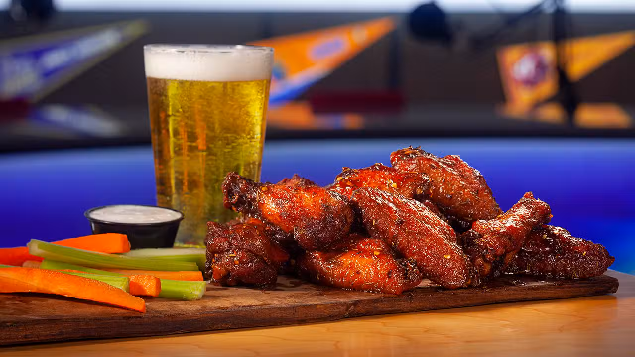 glass of beer, wings with carrots, celery sticks - The Rose - Playbook Sports Bar & Grill, Dumfries, VA