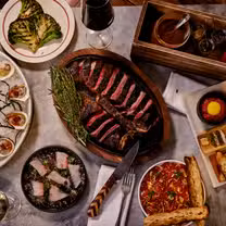 A photo of Quality Meats restaurant