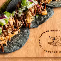 A photo of Tacos Del Cartel - Perkins Rowe restaurant