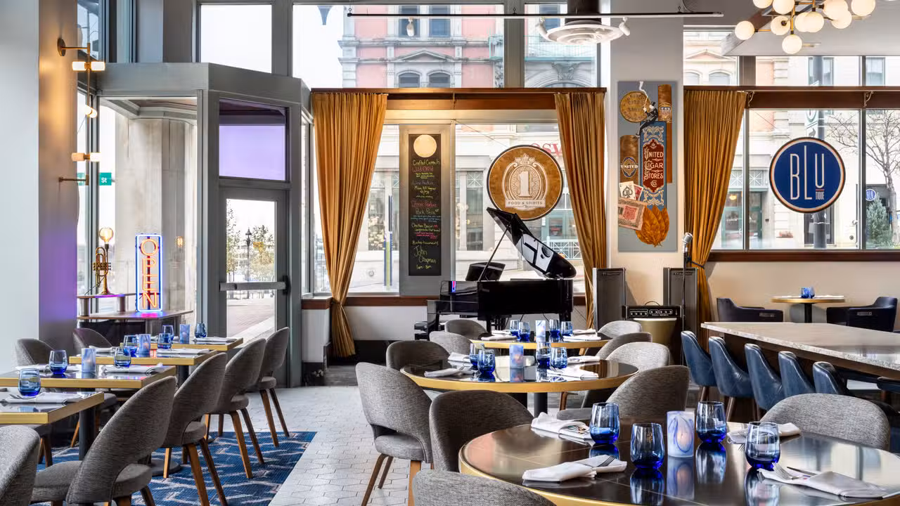 Floor to ceiling windows, live entertainment - The 1 Food & Spirits, located inside BLU-Tique Hotel, Akron, OH