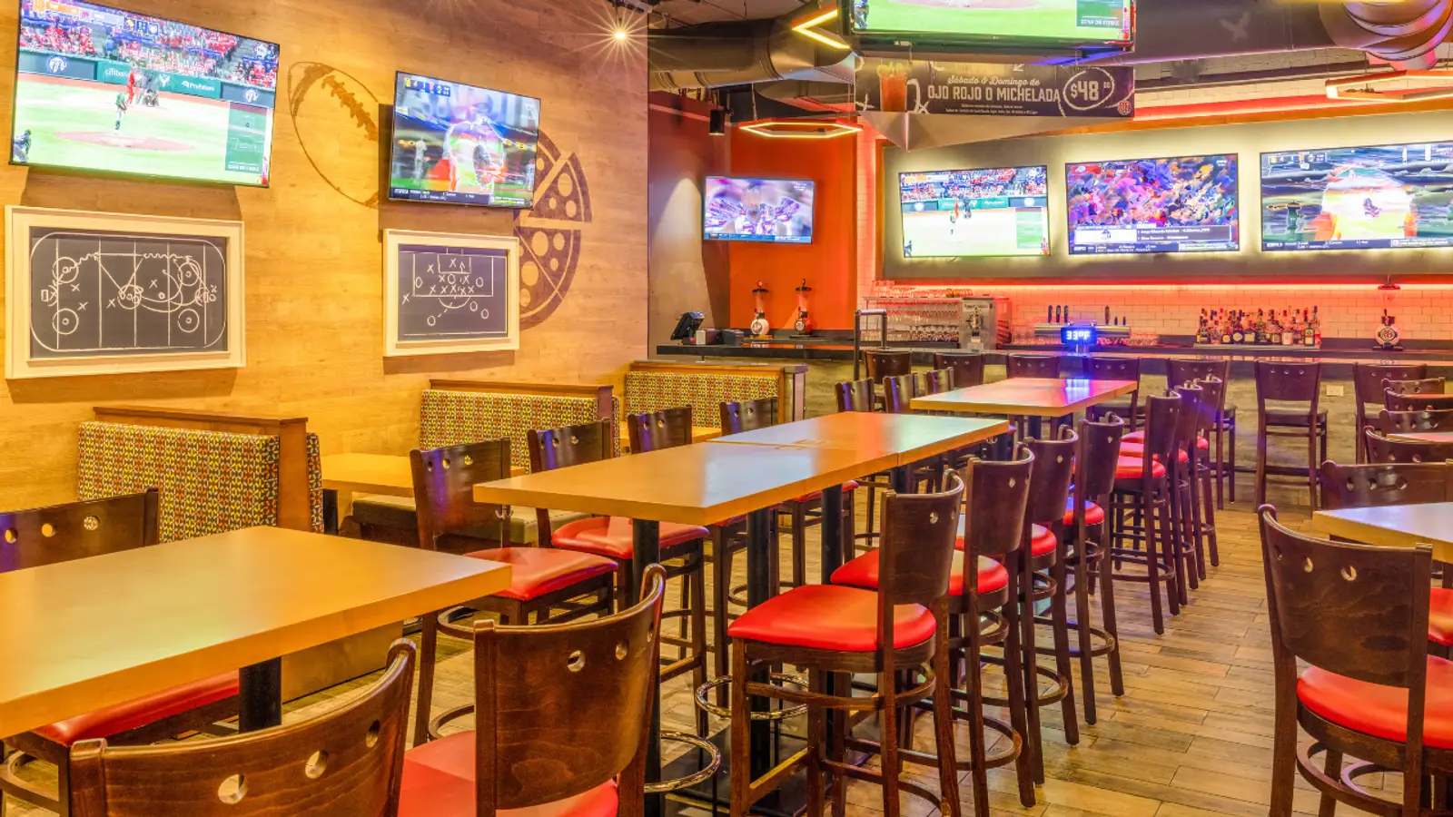 Boston's Pizza sports-bar seating with several televisions