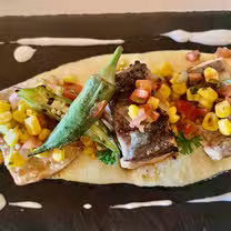 A photo of Que-‘Riosity restaurant