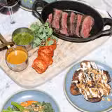 Chateaubriand for two with bottle of wine photo