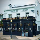 Cover image for Thatched House