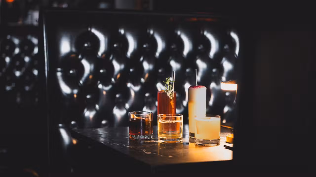 Cocktails in booth at Midnight Cowboy - Midnight Cowboy, Austin, TX