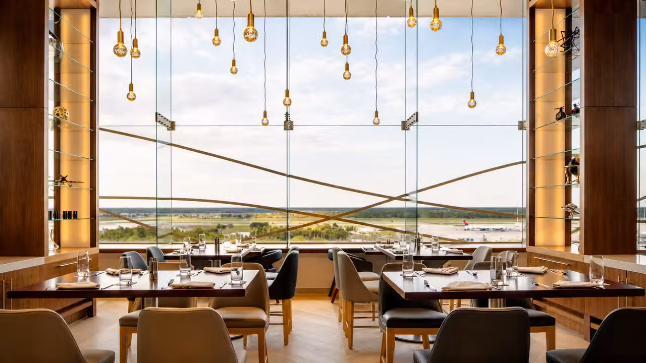 Floor to ceiling views at Hemisphere Restaurant - Hemisphere Restaurant at Hyatt Regency Orlando Airport, Orlando, FL