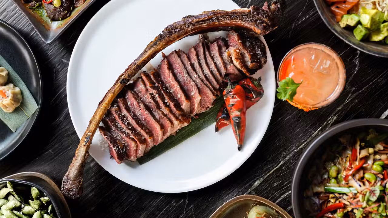 Tomahawk with Asian Appetizers like edamame - Salty Flame, Miami, FL