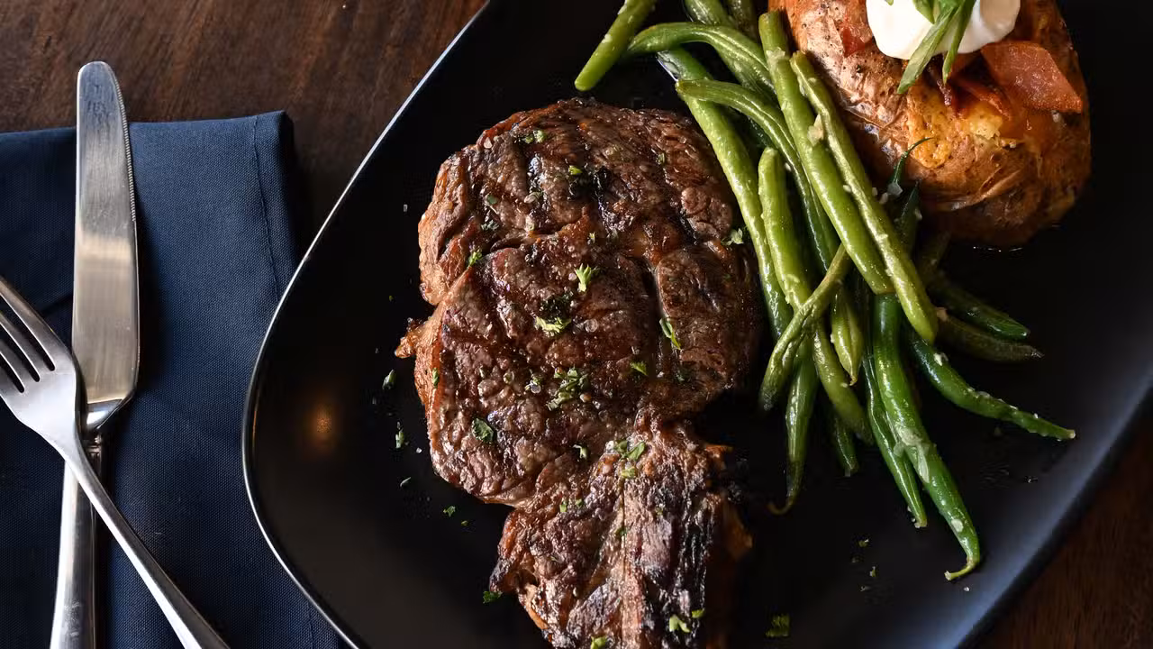Grilled steak with classic steakhouse sides. - Black Diamond Prime, Johnstown, OH